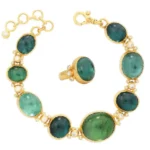Image of Gurhan ring and necklace in gold, diamond, and tourmaline