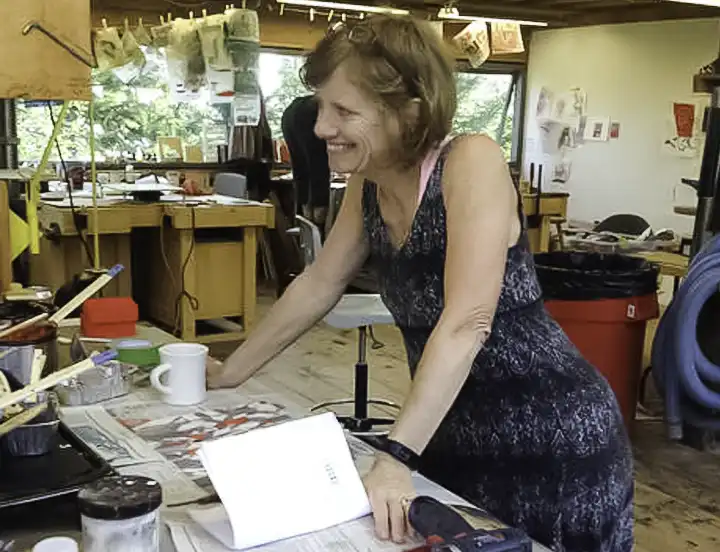A photo of artist Graceann Warn in her studio