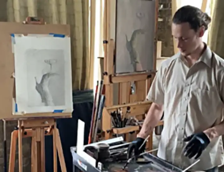 A photo of artist Jairid Rossow in his studio