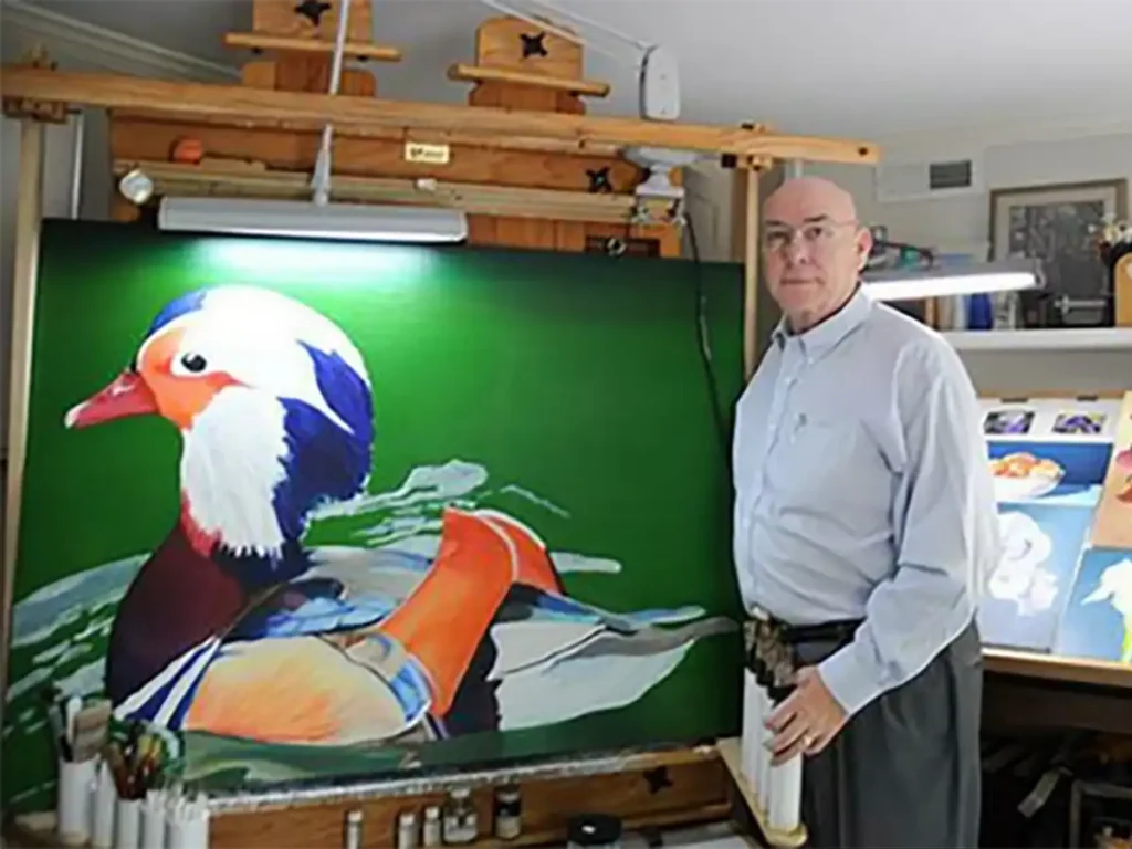 a photo of artist Michael McChesney in his studio